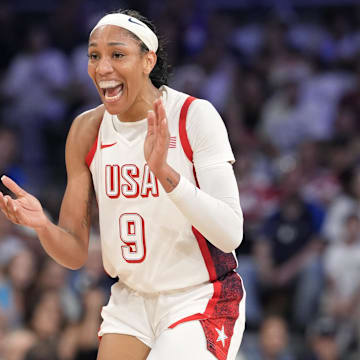 Jul 29, 2024; Villeneuve-d'Ascq, France; United States forward A'Ja Wilson (9) celebrates during the first half against Japan during the Paris 2024 Olympic Summer Games at Stade Pierre-Mauroy. Mandatory Credit: John David Mercer-Imagn Images