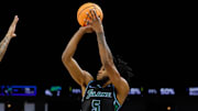 Mar 15, 2025; Fort Worth, TX, USA;  Tulane Green Wave guard Mari Jordan (5) scores a three-point basket against Memphis Tigers guard Colby Rogers (3) during the first half at Dickies Arena.