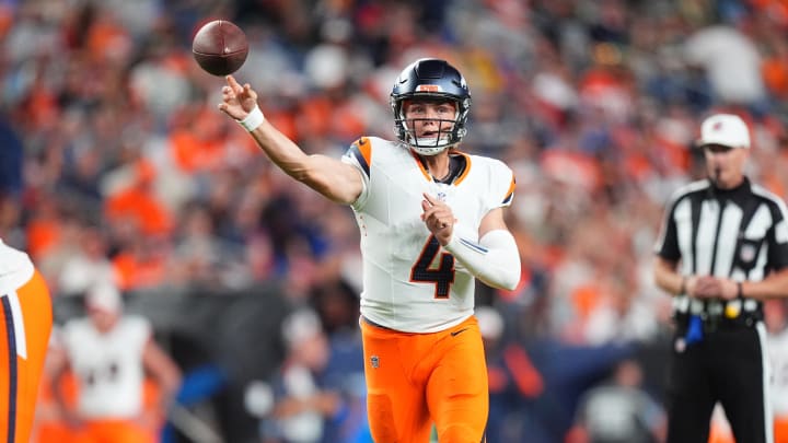 Denver Broncos quarterback Zach Wilson (4) passes the ball in the second half against the Green Bay Packers at Empower Field at Mile High.