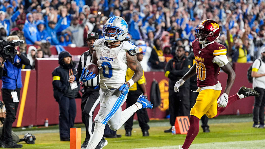 Detroit Lions running back Jahmyr Gibbs (0) runs for a touchdown against Washington Commanders safety Quan Martin (20) during the second half at Northwest Stadium in Landover, Md. on Sunday, November 9, 2025.