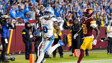 Detroit Lions running back Jahmyr Gibbs (0) runs for a touchdown against Washington Commanders safety Quan Martin (20) during the second half at Northwest Stadium in Landover, Md. on Sunday, November 9, 2025.