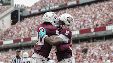 Sep 6, 2025; College Station, Texas, USA; Texas A&M Aggies quarterback Marcel Reed (10) and Texas A&M Aggies running back Le'Veon Moss (8) celebrate after a touchdown during the second quarter against the Utah State Aggies at Kyle Field. Mandatory Credit: Sean Thomas-Imagn Images
