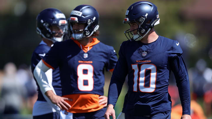 May 23, 2024; Englewood, CO, USA; Denver Broncos quarterback Bo Nix (10) and quarterback Jarrett Stidham (8) during organized team activities at Centura Health Training Center. 