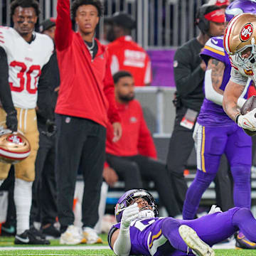 Oct 23, 2023; Minneapolis, Minnesota, USA; San Francisco 49ers tight end George Kittle (85) catches a pass against the Minnesota Vikings in the fourth quarter at U.S. Bank Stadium. Mandatory Credit: Brad Rempel-Imagn Images