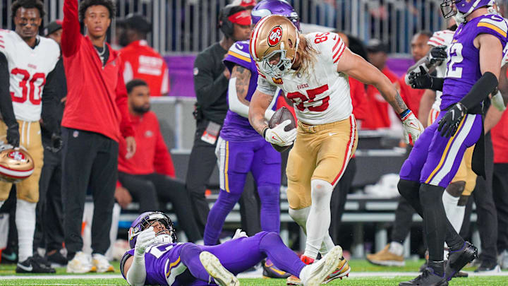 Oct 23, 2023; Minneapolis, Minnesota, USA; San Francisco 49ers tight end George Kittle (85) catches a pass against the Minnesota Vikings in the fourth quarter at U.S. Bank Stadium. Mandatory Credit: Brad Rempel-Imagn Images