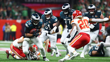 Feb 9, 2025; New Orleans, LA, USA; Philadelphia Eagles running back Saquon Barkley (26) runs the ball against the Kansas City Chiefs in the second half in Super Bowl LIX at Ceasars Superdome. Mandatory Credit: Mark J. Rebilas-Imagn Images