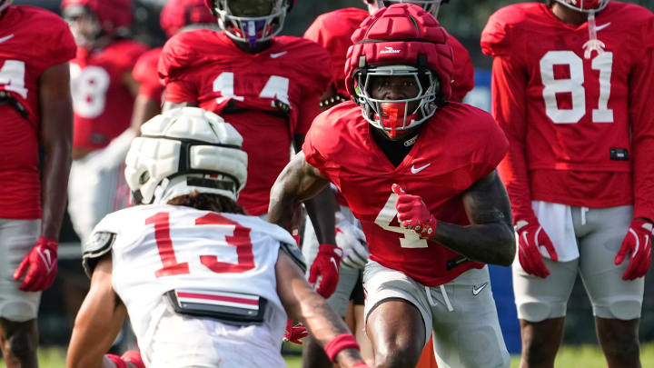 Aug 8, 2024; Columbus, Ohio, USA; Ohio State Buckeyes wide receiver Jeremiah Smith (4) lines up across from cornerback Miles Lockhart (13) during football practice at the Woody Hayes Athletic Complex.