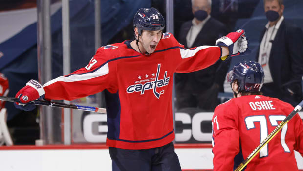 Washington Capitals defenseman celebrates a goal with teammate T.J. Oshie