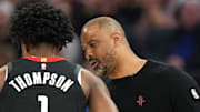 Apr 26, 2025; San Francisco, California, USA; Houston Rockets head coach Ime Udoka (right) talks with forward Amen Thompson (1) during the second quarter of game three of first round for the 2024 NBA Playoffs against the Golden State Warriors at Chase Center. Mandatory Credit: Darren Yamashita-Imagn Images