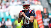 Sep 14, 2025; Miami Gardens, Florida, USA; New England Patriots quarterback Drake Maye (10) looks to pass against the Miami Dolphins in the second quarter at Hard Rock Stadium. Mandatory Credit: Nathan Ray Seebeck-Imagn Images