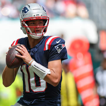 Sep 14, 2025; Miami Gardens, Florida, USA; New England Patriots quarterback Drake Maye (10) looks to pass against the Miami Dolphins in the second quarter at Hard Rock Stadium. Mandatory Credit: Nathan Ray Seebeck-Imagn Images