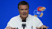 Oct 23, 2024; Kansas City, MO, USA; Kansas Jayhawks head coach Bill Self talks to media during the Big 12 Men’s Basketball Media Day at T-Mobile Center. Mandatory Credit: Jay Biggerstaff-Imagn Images
