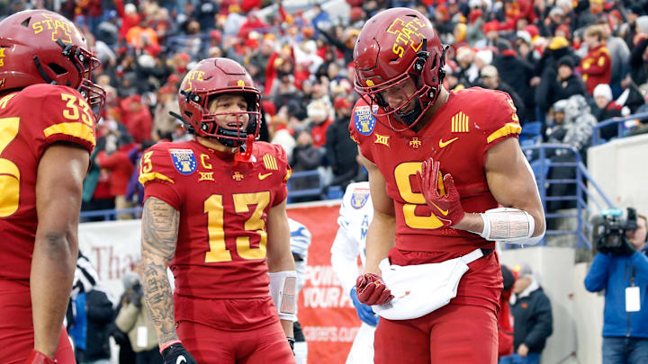 Dec 29, 2023; Memphis, TN, USA; Iowa State Cyclones wide receiver Jaylin Noel (13) and wide receiver Jayden Higgins (9) react after a touchdown during the first half against the Memphis Tigers at Simmons Bank Liberty Stadium. Mandatory Credit: Petre Thomas-Imagn Images