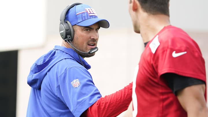 Jul 27, 2023; East Rutherford, NJ, USA;  Offensive coordinator Mike Kafka, left, and New York Giants quarterback Daniel Jones (8) talk on day two of training camp at the Quest Diagnostics Training Facility. Mandatory Credit: Danielle Parhizkaran-Imagn Images