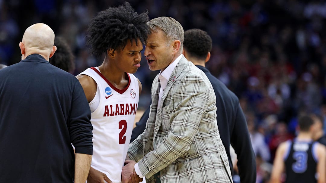 Mar 27, 2025; Newark, NJ, USA; Alabama Crimson Tide guard Aden Holloway (2) talks to head coach Nate Oats during the second half against the Brigham Young Cougars during an East Regional semifinal of the 2025 NCAA tournament at Prudential Center. Mandatory Credit: Vincent Carchietta-Imagn Images