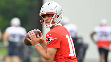 Jun 9, 2025; Foxborough, MA, USA; New England Patriots quarterback Drake Maye (10) looks before passing the ball during minicamp at Gillette Stadium. Mandatory Credit: Eric Canha-Imagn Images