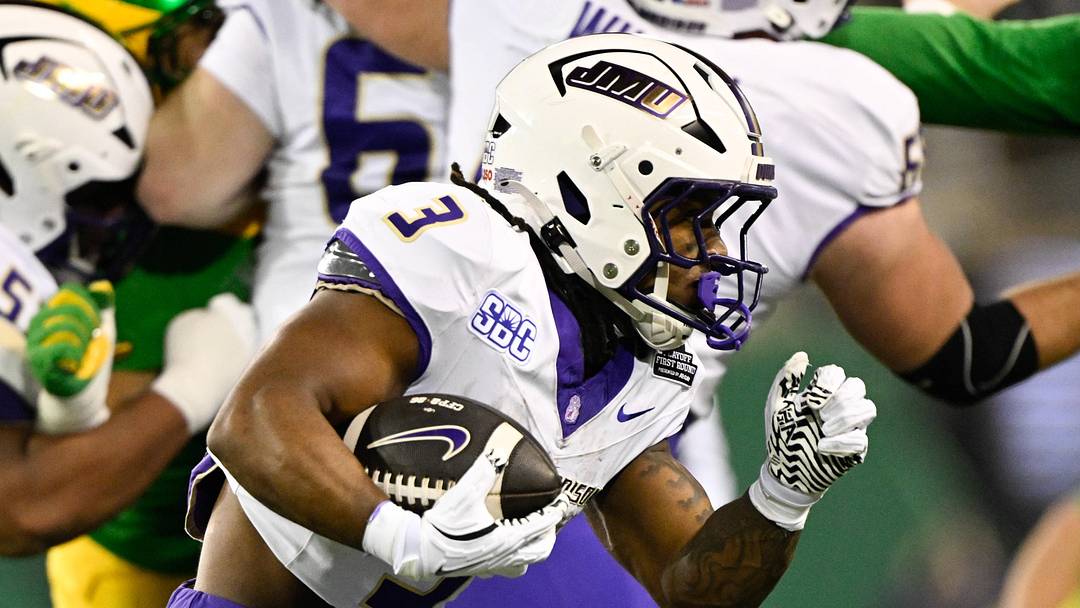 Dec 20, 2025; Eugene, OR, USA;  James Madison Dukes running back Wayne Knight (3) rushes during the second quarter against the Oregon Ducks at Autzen Stadium. Mandatory Credit: Troy Wayrynen-Imagn Images