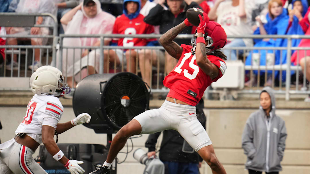 Wide receiver Chris Henry Jr. (15) catches a pass over safety Leroy Roker III (10) during the Ohio State football spring game at Ohio Stadium in Columbus on April 18, 2026.