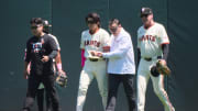 May 12, 2024; San Francisco, California, USA; San Francisco Giants outfielder Jung Hoo Lee (51) walks off the field with an injury accompanied by senior director of athletic training Dave Groeschner and manager Bob Melvin (6) against the Cincinnati Reds during the first inning at Oracle Park. Mandatory Credit: Robert Edwards-USA TODAY Sports