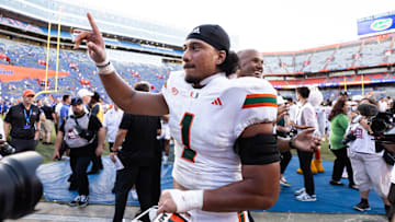 Aug 31, 2024; Gainesville, Florida, USA; Miami Hurricanes quarterback Cam Ward (1) reacts after a game against the Florida Gators at Ben Hill Griffin Stadium. Mandatory Credit: Matt Pendleton-Imagn Images
