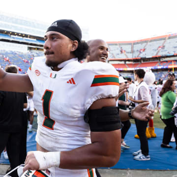 Miami Hurricanes quarterback Cam Ward celebrates a big win