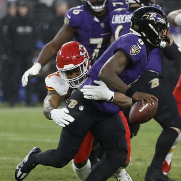 Jan 28, 2024; Baltimore, Maryland, USA; Baltimore Ravens quarterback Lamar Jackson (8) is sacked by Kansas City Chiefs defensive end Mike Danna (51) in the AFC Championship football game at M&T Bank Stadium. Mandatory Credit: Geoff Burke-USA TODAY Sports