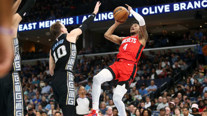 Mar 24, 2023; Memphis, Tennessee, USA; Houston Rockets guard Jalen Green (4) shoots as Memphis Grizzlies guard Luke Kennard (10) defends during the first half at FedExForum. Mandatory Credit: Petre Thomas-USA TODAY Sports