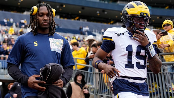 Michigan running back Savion Hiter, left, and quarterback Bryce Underwood (19) take the field for the spring game at Michigan Stadium in Ann Arbor on Saturday, April 18, 2026.