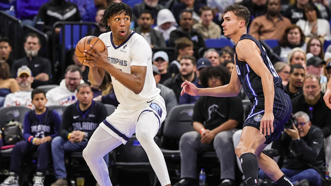 Feb 21, 2025; Orlando, Florida, USA; Memphis Grizzlies forward GG Jackson (45) moves the ball in front of Orlando Magic forward Tristan da Silva (23) during the second quarter at Kia Center. Mandatory Credit: Mike Watters-Imagn Images