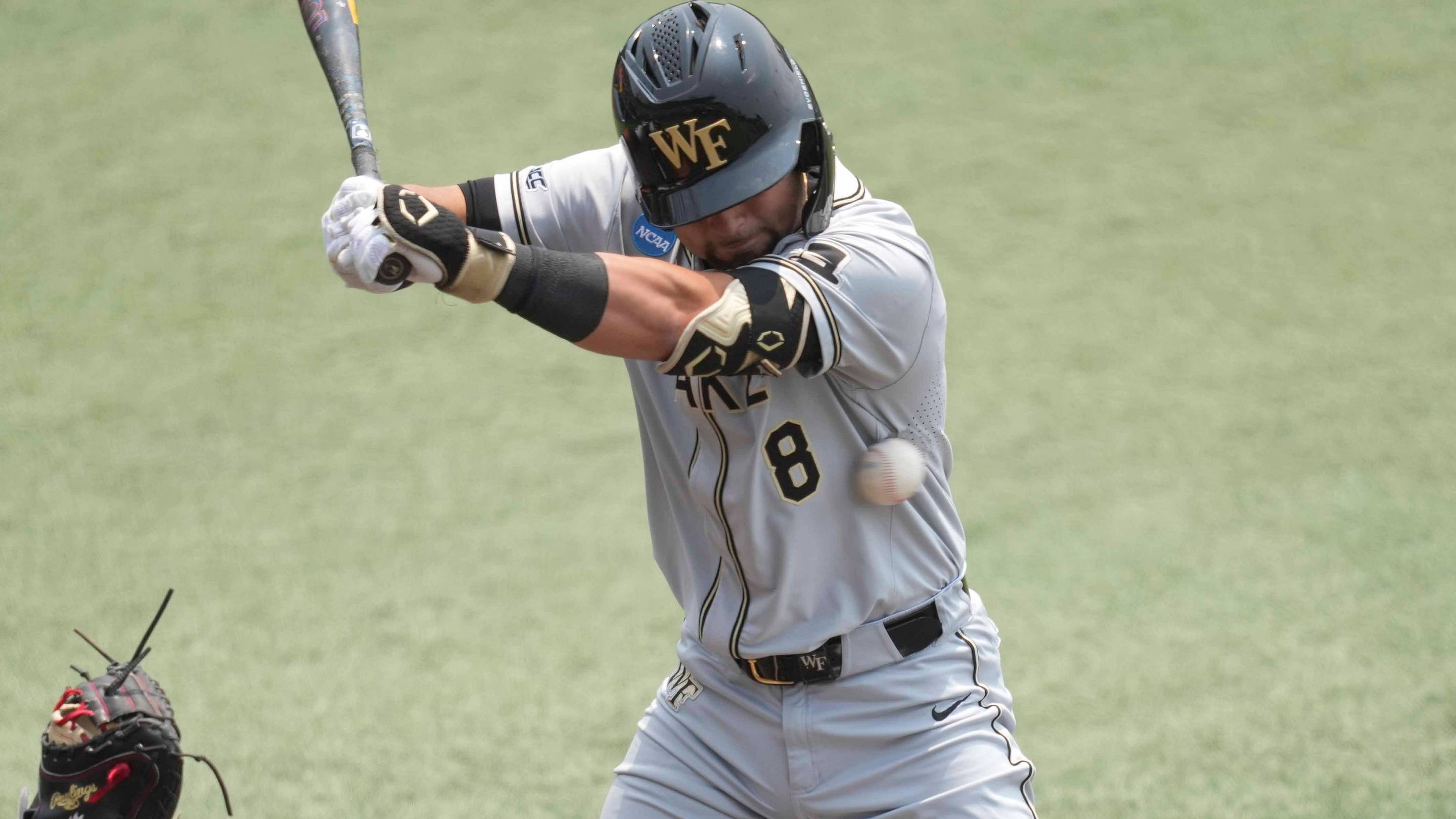 Wake Forest catcher Matt Conte (8) gets hit by a pitch during a NCAA regional baseball game between the Cincinnati Bearcats and Wake Forest Demon Deacons at Lindsey Nelson Stadium in Knoxville, Tenn., on June 1, 2025.