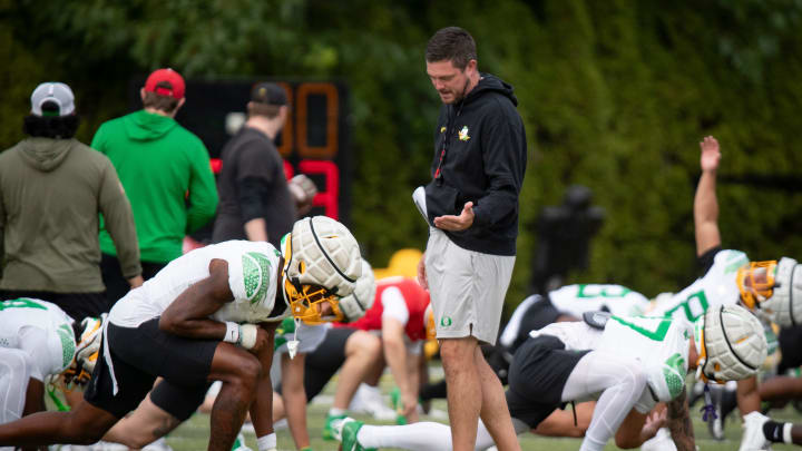 Oregon had coach Dan Lanning talks to wide receiver 	Traeshon Holden during practice with the Oregon Ducks Tuesday, Aug. 27, 2024 at the Hatfield-Dowlin Complex in Eugene, Ore.