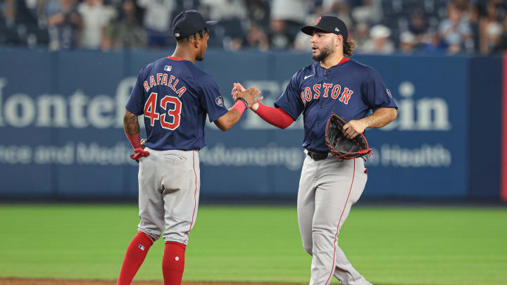 Jul 5, 2024; Bronx, New York, USA; Boston Red Sox center fielder Ceddanne Rafaela (43) and right fielder Wilyer Abreu (52) celebrates after defeating the New York Yankees at Yankee Stadium. Mandatory Credit: Vincent Carchietta-USA TODAY Sports