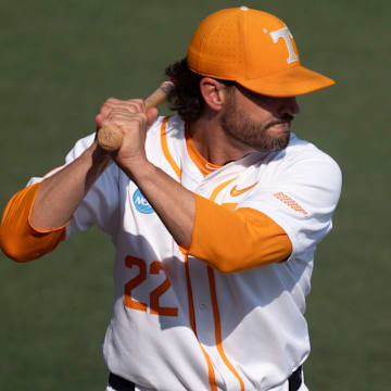 Tennessee baseball coach Tony Vitello hits balls to his players as they warm up before the start of the NCAA college baseball Knoxville Regional against Wake Forest on June 2, 2025, in Knoxville, Tenn.