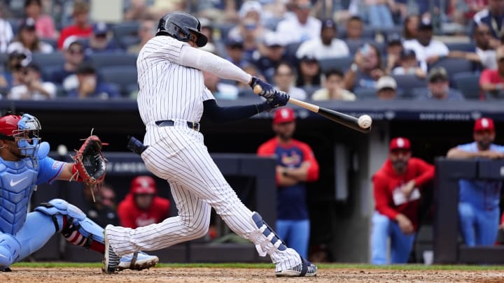 Aug 31, 2024; Bronx, New York, USA; New York Yankees right fielder Juan Soto (22) hits a double against the St. Louis Cardinals during the ninth inning at Yankee Stadium. Mandatory Credit: Gregory Fisher-USA TODAY Sports