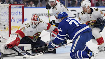 May 18, 2025; Toronto, Ontario, CAN; Florida Panthers goaltender Sergei Bobrovsky (72) makes a save on Toronto Maple Leafs forward Bobby McMann (74) as Florida Panthers defenseman Gustav Forsling (42) helps out during the first period of game seven of the second round of the 2025 Stanley Cup Playoffs at Scotiabank Arena. Mandatory Credit: John E. Sokolowski-Imagn Images
