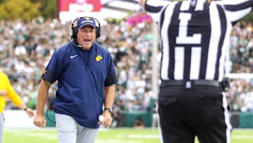 Sep 6, 2025; Athens, Ohio, USA; West Virginia Mountaineers head coach Rich Rodriguez calls a timeout during the second quarter against the Ohio Bobcats at Peden Stadium. Mandatory Credit: Ben Queen-Imagn Images