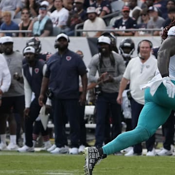 Aug 10, 2025; Chicago, Illinois, USA; Miami Dolphins running back Alexander Mattison (8) runs the ball against the Chicago Bears during the second half at Soldier Field. Mandatory Credit: David Banks-Imagn Images