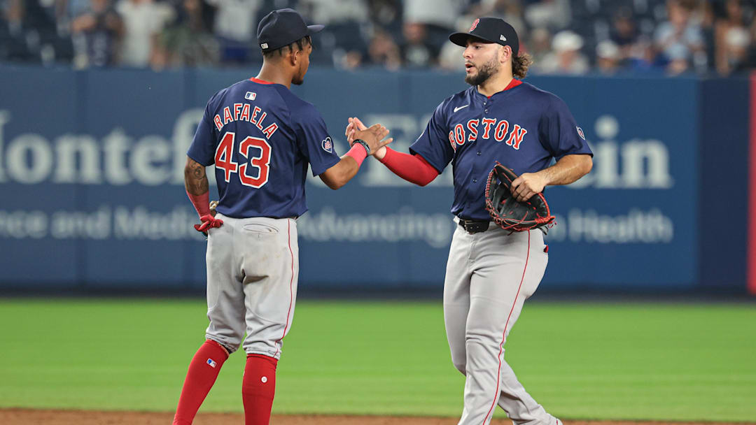 Jul 5, 2024; Bronx, New York, USA; Boston Red Sox center fielder Ceddanne Rafaela (43) and right fielder Wilyer Abreu (52) celebrates after defeating the New York Yankees at Yankee Stadium. Mandatory Credit: Vincent Carchietta-Imagn Images