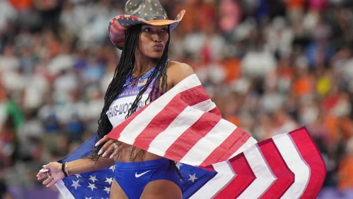 Aug 8, 2024; Saint-Denis, FRANCE; Tara Davis-Woodhall (USA) celebrates winning the women's long jump final during the Paris 2024 Olympic Summer Games at Stade de France. 