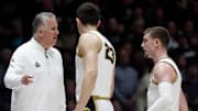 Purdue Boilermakers head coach Matt Painter talks to forward Camden Heide (23) and guard Braden Smith (3) 