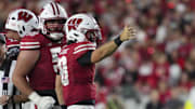 Aug 28, 2025; Madison, Wisconsin, USA;  Wisconsin Badgers quarterback Danny O'Neil (18) celebrates after earning a first down during the third quarter against the Miami (OH) RedHawks at Camp Randall Stadium. 