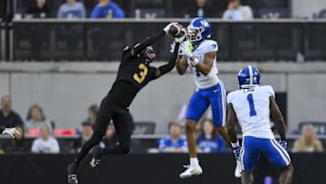 Nov 22, 2025; Nashville, Tennessee, USA;  Vanderbilt Commodores cornerback Kolbey Taylor (3) intercepts the pass thrown to Kentucky Wildcats wide receiver DJ Miller (7) during the first half at FirstBank Stadium. Mandatory Credit: Steve Roberts-Imagn Images