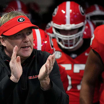Georgia coach Kirby Smart takes the field with his team before the start of the SEC championship game against Texas in Atlanta, on Saturday, Dec. 7, 2024.