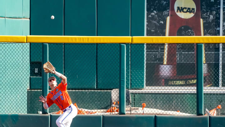 Jun 26, 2023; Omaha, NE, USA; Florida Gators right fielder Ty Evans (2) makes a catch for an out against the LSU Tigers during the first inning at Charles Schwab Field Omaha. Mandatory Credit: Dylan Widger-USA TODAY Sports