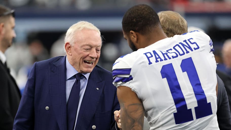 Dallas Cowboys owner Jerry Jones meets with outside linebacker Micah Parsons prior to a playoff game.