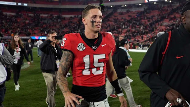 Georgia quarterback Carson Beck (15) leaves the field after winning a NCAA college football game against Tennessee in Athens,