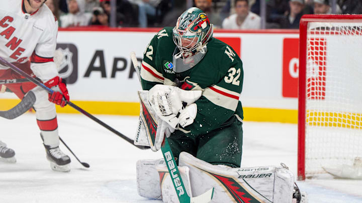 Feb 6, 2025; Saint Paul, Minnesota, USA; Minnesota Wild goaltender Filip Gustavsson (32) makes a save against the Carolina Hurricanes in the first period at Xcel Energy Center. Mandatory Credit: Matt Blewett-Imagn Images