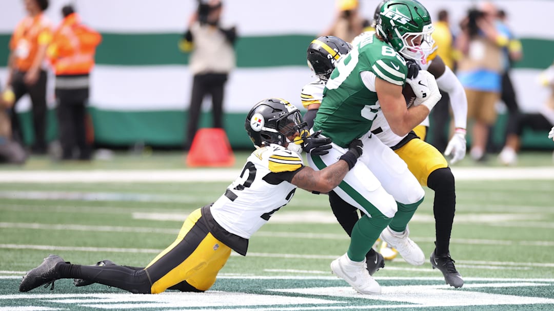 Sep 7, 2025; East Rutherford, New Jersey, USA; Pittsburgh Steelers safety Juan Thornhill (22) tackles New York Jets tight end Jeremy Ruckert (89) during the second half at MetLife Stadium. Mandatory Credit: Wendell Cruz-Imagn Images