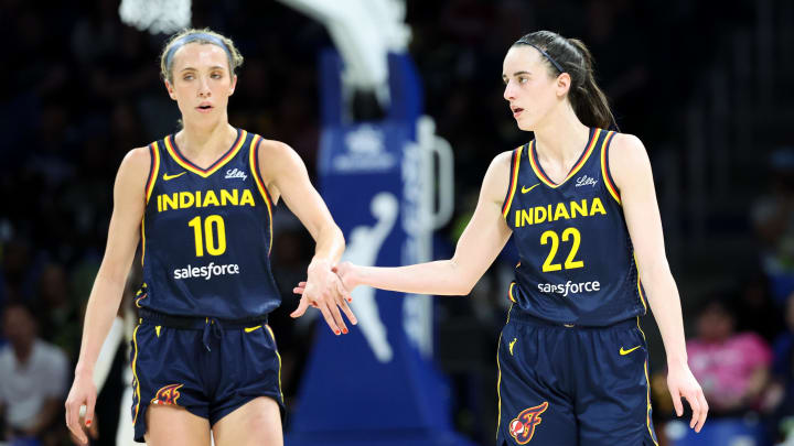 Indiana Fever guard Caitlin Clark (22) celebrates with Indiana Fever guard Lexie Hull (10) during the second quarter against the Dallas Wings at College Park Center.