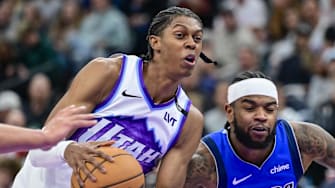 Oct 13, 2025; Salt Lake City, Utah, USA; Utah Jazz forward Cody Williams (5) drives towards the center against Dallas Mavericks guard Jaden Hardy (1) during the second half at Delta Center. Mandatory Credit: Peter Creveling-Imagn Images